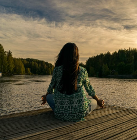 sitting on a dock overlooking lake