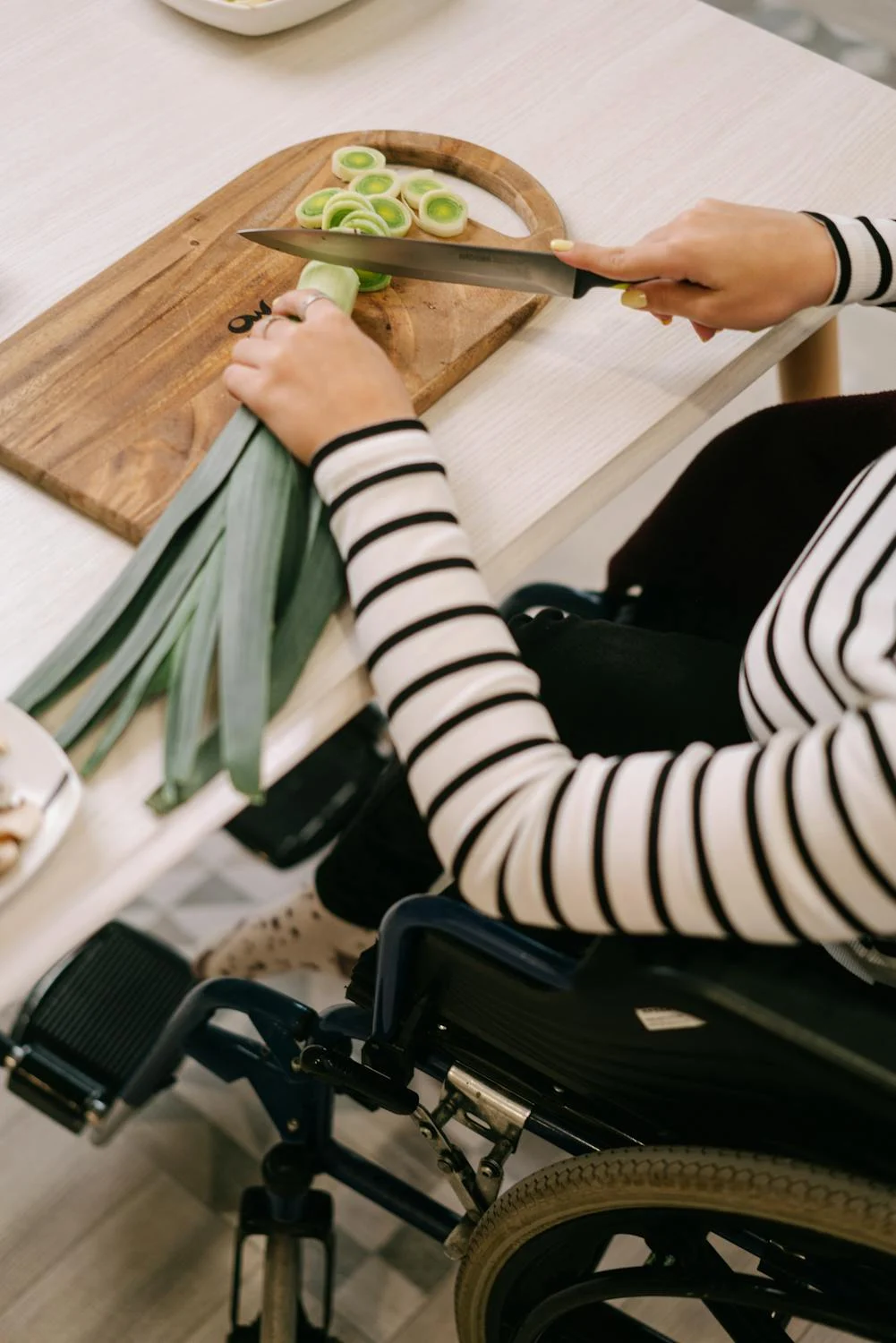 woman using assistive technology in the kitchen